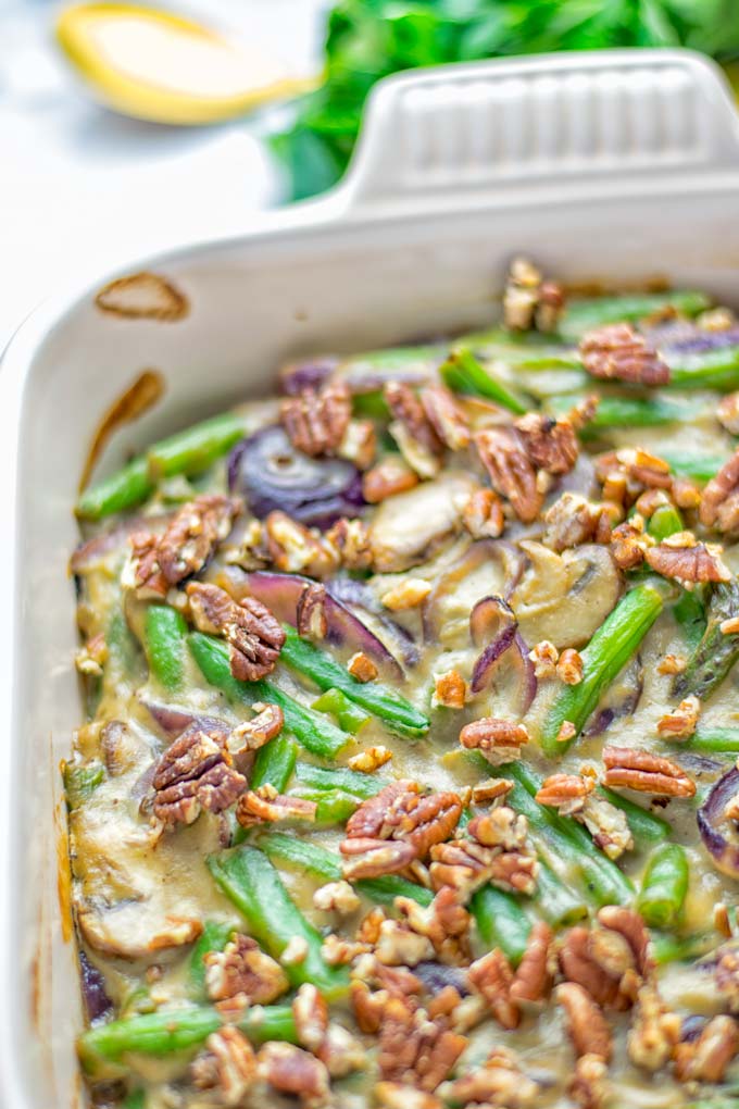 This Green Bean Casserole with Maple Pecans is insanely delicious and super easy to make with the best homemade cream of mushroom soup you can ask for. Entirely vegan, gluten free and so fantastic for dinner, lunch, meal prep, work lunch. An amazing dairy free alternative uses maple pecans instead of breadcrumbs. Perfect for holidays, Christmas. #vegan #glutenfree #dairyfree #vegetarian #dinner #lunch #mealprep #worklunchideas #contentednesscooking #holidaymeals #christmas #greenbeancasserole