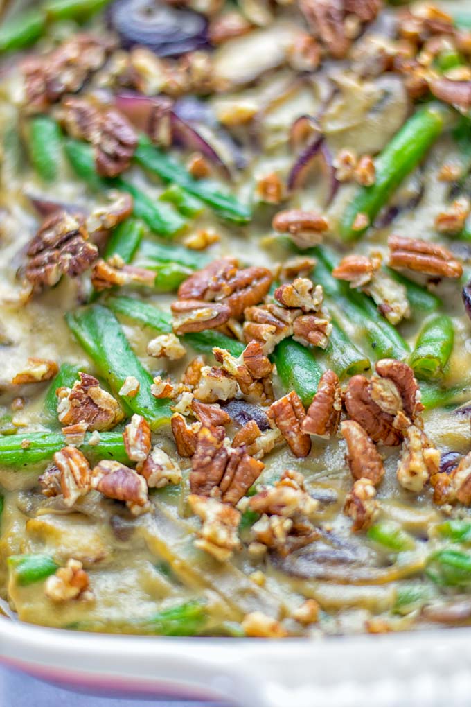 This Green Bean Casserole with Maple Pecans is insanely delicious and super easy to make with the best homemade cream of mushroom soup you can ask for. Entirely vegan, gluten free and so fantastic for dinner, lunch, meal prep, work lunch. An amazing dairy free alternative uses maple pecans instead of breadcrumbs. Perfect for holidays, Christmas. #vegan #glutenfree #dairyfree #vegetarian #dinner #lunch #mealprep #worklunchideas #contentednesscooking #holidaymeals #christmas #greenbeancasserole