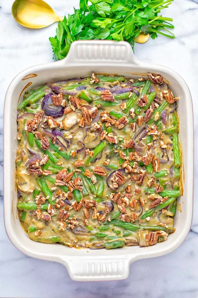 This Green Bean Casserole with Maple Pecans is insanely delicious and super easy to make with the best homemade cream of mushroom soup you can ask for. Entirely vegan, gluten free and so fantastic for dinner, lunch, meal prep, work lunch. An amazing dairy free alternative uses maple pecans instead of breadcrumbs. Perfect for holidays, Christmas. #vegan #glutenfree #dairyfree #vegetarian #dinner #lunch #mealprep #worklunchideas #contentednesscooking #holidaymeals #christmas #greenbeancasserole