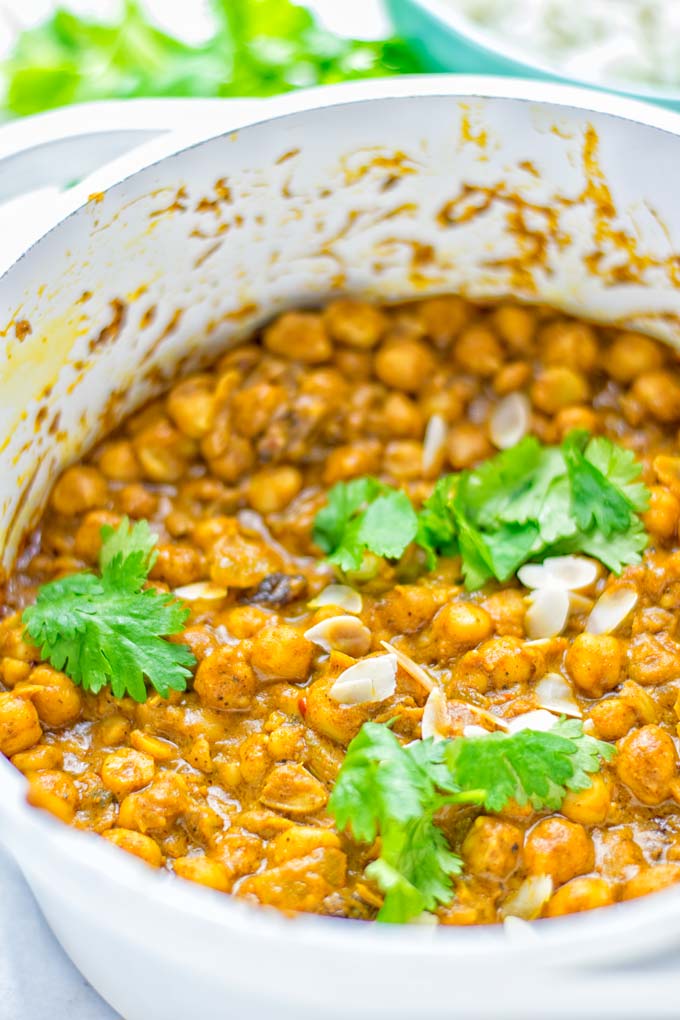 Insanely delicious One Pot Chickpea Biryani full of amazing flavors and naturally vegan, gluten free. An easy dish which is perfect for lunch, dinner, meal prep and work lunch. If you’re looking for a super easy biryani try it now. #vegan #glutenfree #dairyfree #vegetarian #chickpeas #chickpeabiryani #biryani #onepotmeals #mealprep #worklunchideas #dinner #lunch #contentednesscooking