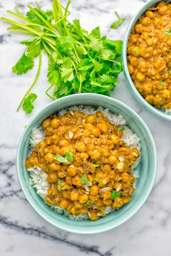 Insanely delicious One Pot Chickpea Biryani full of amazing flavors and naturally vegan, gluten free. An easy dish which is perfect for lunch, dinner, meal prep and work lunch. If you’re looking for a super easy biryani try it now. #vegan #glutenfree #dairyfree #vegetarian #chickpeas #chickpeabiryani #biryani #onepotmeals #mealprep #worklunchideas #dinner #lunch #contentednesscooking