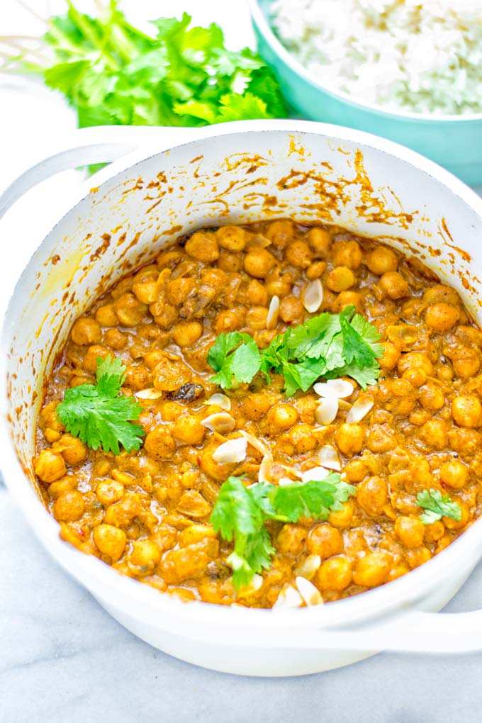 Insanely delicious One Pot Chickpea Biryani full of amazing flavors and naturally vegan, gluten free. An easy dish which is perfect for lunch, dinner, meal prep and work lunch. If you’re looking for a super easy biryani try it now. #vegan #glutenfree #dairyfree #vegetarian #chickpeas #chickpeabiryani #biryani #onepotmeals #mealprep #worklunchideas #dinner #lunch #contentednesscooking