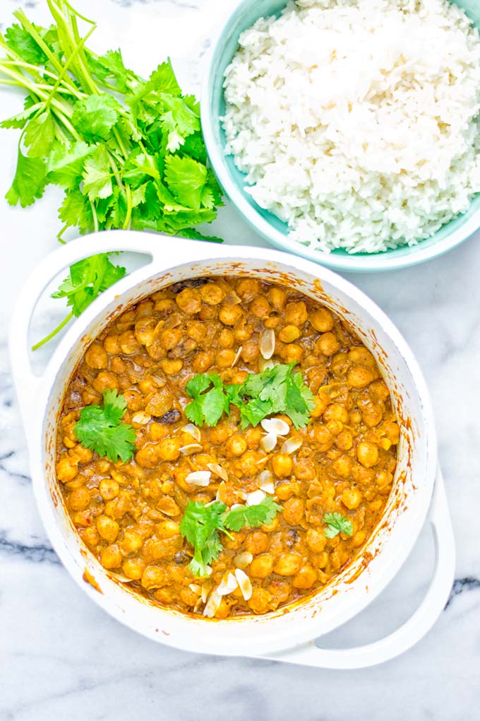 Insanely delicious One Pot Chickpea Biryani full of amazing flavors and naturally vegan, gluten free. An easy dish which is perfect for lunch, dinner, meal prep and work lunch. If you’re looking for a super easy biryani try it now. #vegan #glutenfree #dairyfree #vegetarian #chickpeas #chickpeabiryani #biryani #onepotmeals #mealprep #worklunchideas #dinner #lunch #contentednesscooking