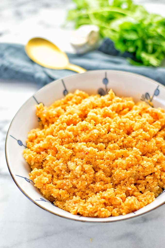 This Spanish Cauliflower Rice is naturally vegan, gluten free and seriously the best. It’s super easy to make in one pan and packed with amazing flavors. An easy recipe for lunch, dinner, meal prep and work lunch. It’s delicious on its own or as side dish. Try this great dairy free and low carb alternative now. #vegan #glutenfree #dairyfree #vegetarian #cauliflower #spanish #rice #lowcarb #mealprep #worklunchideas #lunch #dinner #sidedish #contentednesscooking #easyfood #budgetmeals