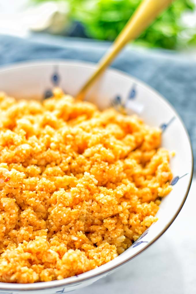 This Spanish Cauliflower Rice is naturally vegan, gluten free and seriously the best. It’s super easy to make in one pan and packed with amazing flavors. An easy recipe for lunch, dinner, meal prep and work lunch. It’s delicious on its own or as side dish. Try this great dairy free and low carb alternative now. #vegan #glutenfree #dairyfree #vegetarian #cauliflower #spanish #rice #lowcarb #mealprep #worklunchideas #lunch #dinner #sidedish #contentednesscooking #easyfood #budgetmeals