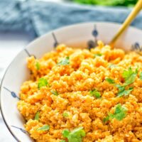 This Spanish Cauliflower Rice is naturally vegan, gluten free and seriously the best. It’s super easy to make in one pan and packed with amazing flavors. An easy recipe for lunch, dinner, meal prep and work lunch. It’s delicious on its own or as side dish. Try this great dairy free and low carb alternative now. #vegan #glutenfree #dairyfree #vegetarian #cauliflower #spanish #rice #lowcarb #mealprep #worklunchideas #lunch #dinner #sidedish #contentednesscooking #easyfood #budgetmeals