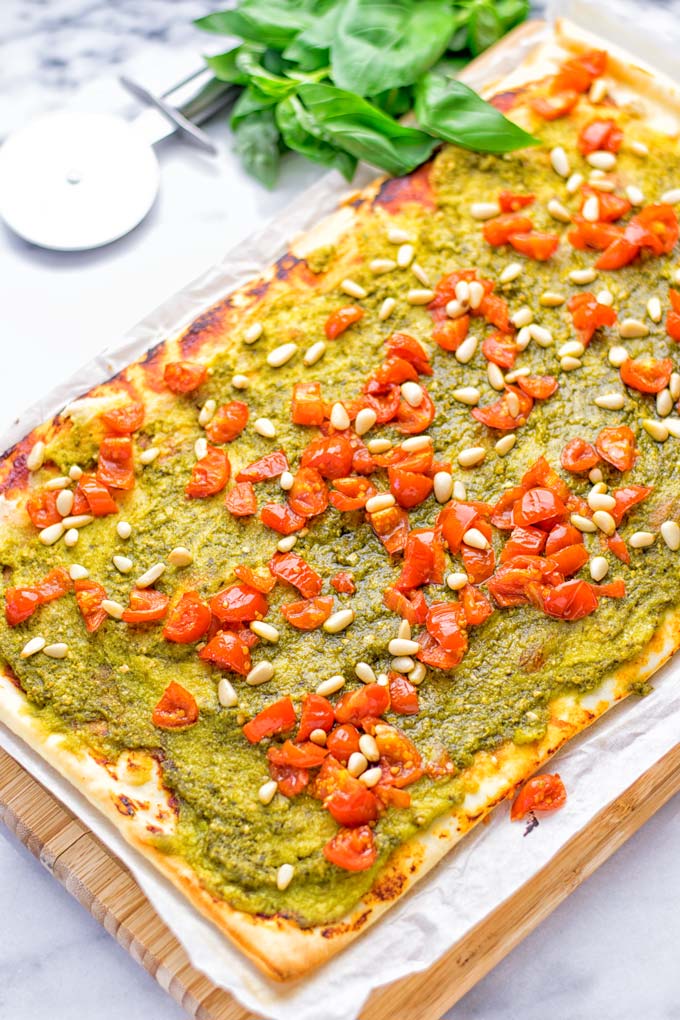 This White Bean and Pesto Pizza is super easy to make, entirely vegan and gluten free. If you love pizza and pesto you’re coming to the right place. It’s so delicious for lunch, dinner, meal preparation, and work lunch. Try it now and fall in love. #vegan #glutenfree #dairyfree #contentednesscooking #pesto #pizza #mealprep #worklunchideas #easyfood #lunch #dinner