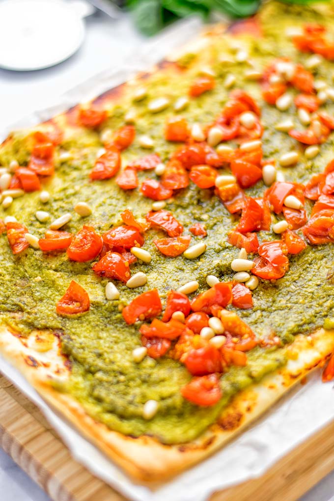 This White Bean and Pesto Pizza is super easy to make, entirely vegan and gluten free. If you love pizza and pesto you’re coming to the right place. It’s so delicious for lunch, dinner, meal preparation, and work lunch. Try it now and fall in love. #vegan #glutenfree #dairyfree #contentednesscooking #pesto #pizza #mealprep #worklunchideas #easyfood #lunch #dinner