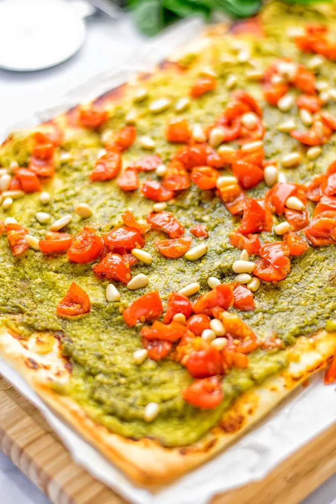 This White Bean and Pesto Pizza is super easy to make, entirely vegan and gluten free. If you love pizza and pesto you’re coming to the right place. It’s so delicious for lunch, dinner, meal preparation, and work lunch. Try it now and fall in love. #vegan #glutenfree #dairyfree #contentednesscooking #pesto #pizza #mealprep #worklunchideas #easyfood #lunch #dinner