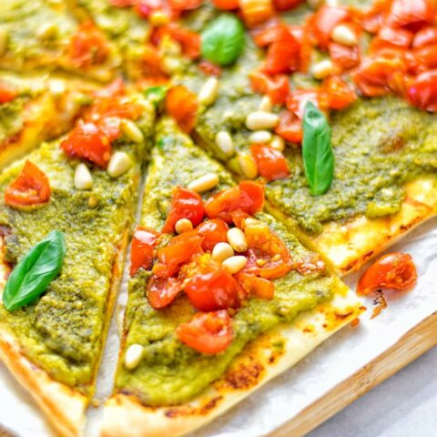 This White Bean and Pesto Pizza is super easy to make, entirely vegan and gluten free. If you love pizza and pesto you’re coming to the right place. It’s so delicious for lunch, dinner, meal preparation, and work lunch. Try it now and fall in love. #vegan #glutenfree #dairyfree #contentednesscooking #pesto #pizza #mealprep #worklunchideas #easyfood #lunch #dinner