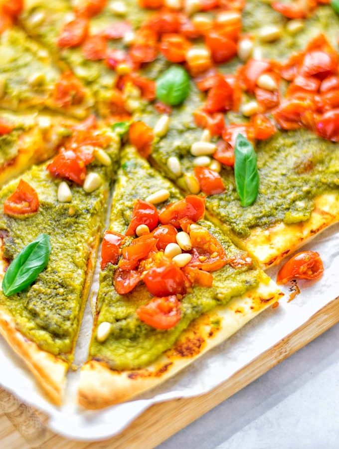 This White Bean and Pesto Pizza is super easy to make, entirely vegan and gluten free. If you love pizza and pesto you’re coming to the right place. It’s so delicious for lunch, dinner, meal preparation, and work lunch. Try it now and fall in love. #vegan #glutenfree #dairyfree #contentednesscooking #pesto #pizza #mealprep #worklunchideas #easyfood #lunch #dinner