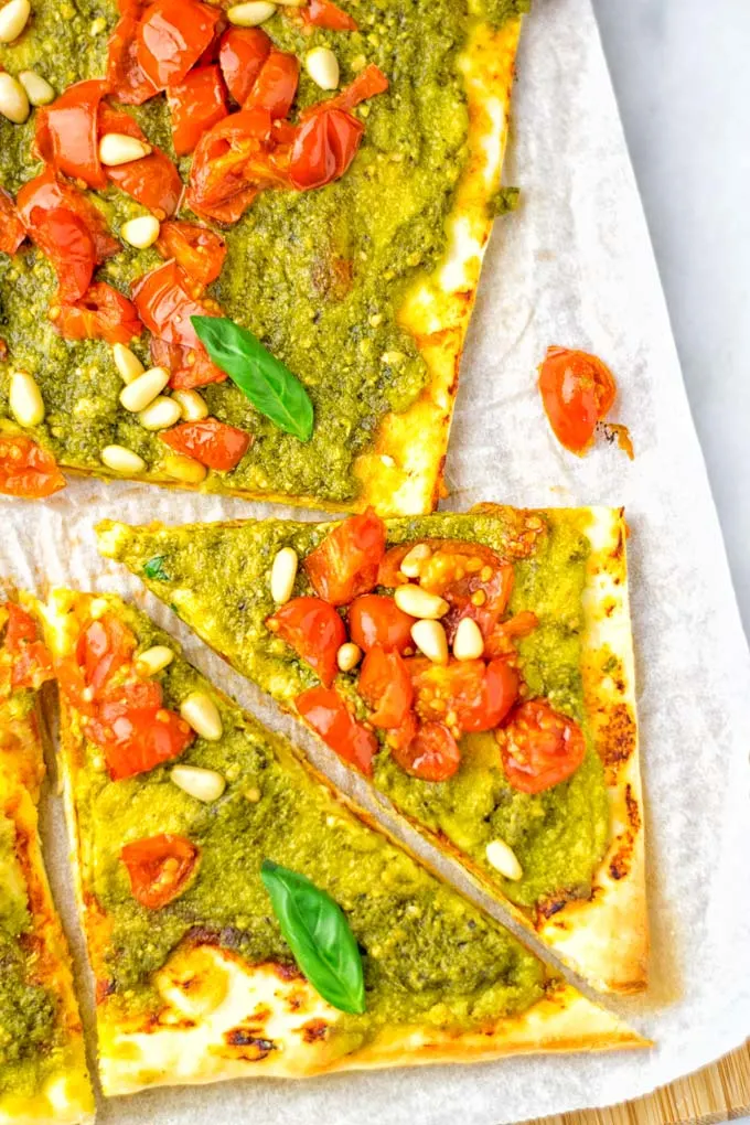 This White Bean and Pesto Pizza is super easy to make, entirely vegan and gluten free. If you love pizza and pesto you’re coming to the right place. It’s so delicious for lunch, dinner, meal preparation, and work lunch. Try it now and fall in love. #vegan #glutenfree #dairyfree #contentednesscooking #pesto #pizza #mealprep #worklunchideas #easyfood #lunch #dinner