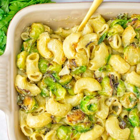 This Garlic Brussels Sprouts Mac and Cheese is entirely vegan, gluten free, and super easy to make. It’s an amazing comfort food for dinner, lunch, meal prep, work lunches, date nights and of course the holidays. Everyone will get addicted to this from the first to the last bite, try it now! #vegan #glutenfree #dairyfree #vegetarian #mealprep #dinner #lunch #worklunchideas #holidays #macandcheese #contentednesscooking #pasta #thanksgiving