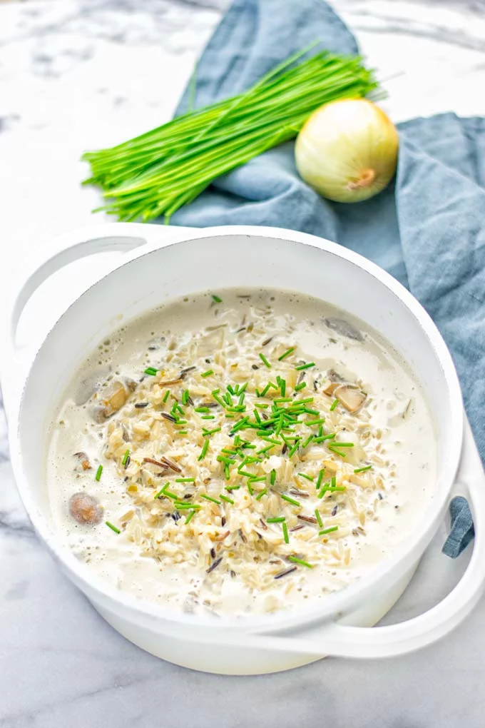 This Wild Rice and Mushroom Soup is entirely vegan, gluten free, and super easy to make in one pot. So amazing for the holidays, Christmas, dinner, lunch, meal preparation and work lunches. If you’re looking for a super easy and delicious one pot meal, you will make this over and over again. #vegan #glutenfree #dairyfree #vegetarian #onepotmeals #holidays #christmas #contentednesscooking #mushrooms #soup #wildricesoup #mushroomsoup #dinner #lunch #mealprep #worklunchideas 