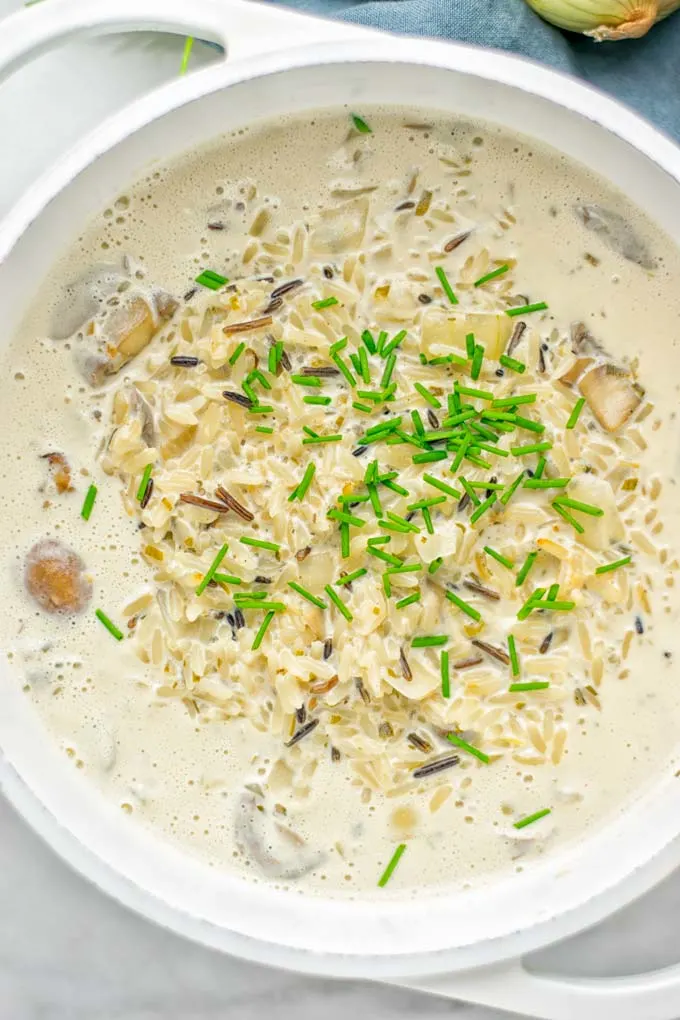 This Wild Rice and Mushroom Soup is entirely vegan, gluten free, and super easy to make in one pot. So amazing for the holidays, Christmas, dinner, lunch, meal preparation and work lunches. If you’re looking for a super easy and delicious one pot meal, you will make this over and over again. #vegan #glutenfree #dairyfree #vegetarian #onepotmeals #holidays #christmas #contentednesscooking #mushrooms #soup #wildricesoup #mushroomsoup #dinner #lunch #mealprep #worklunchideas 