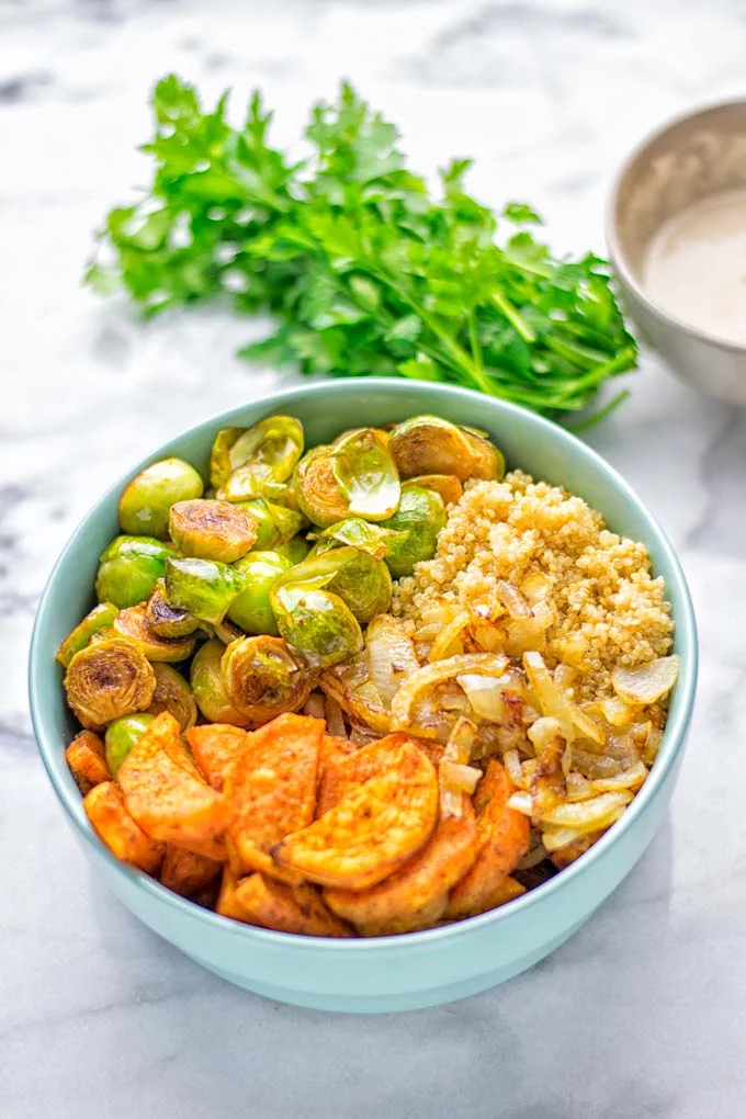 This Cajun Sweet Potato Brussels Sprout Salad is naturally vegan, gluten free and super easy to make. It’s so delicious for lunch, dinner, meal prep, work lunch, holidays and Christmas. Try it now, make this keeper again and again. #vegan #glutenfree #dairyfree #vegetarian #contentednesscooking #mealprep #worklunchideas #dinner #lunch #brusselsproutsalad #cajunsweetpotatoes #holidayfood #christmasrecipes #roastedbrusselssprouts #christmasfood #holidayrecipes 