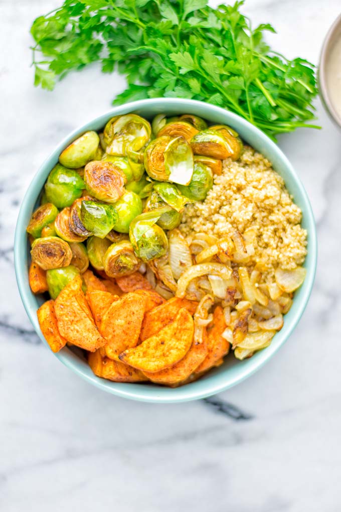 This Cajun Sweet Potato Brussels Sprout Salad is naturally vegan, gluten free and super easy to make. It’s so delicious for lunch, dinner, meal prep, work lunch, holidays and Christmas. Try it now, make this keeper again and again. #vegan #glutenfree #dairyfree #vegetarian #contentednesscooking #mealprep #worklunchideas #dinner #lunch #brusselsproutsalad #cajunsweetpotatoes #holidayfood #christmasrecipes #roastedbrusselssprouts #christmasfood #holidayrecipes 
