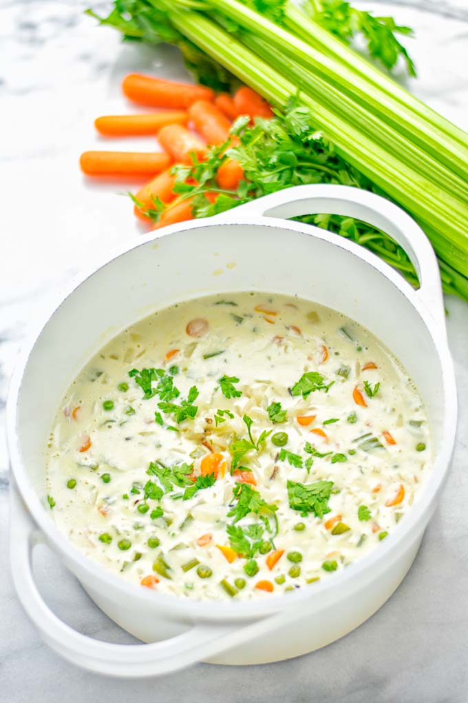 This Cream of Wild Rice Soup is entirely vegan, gluten free and super easy to make in one pot. An amazing soup for dinner, lunch, meal preparation, work lunch and the holidays that the whole family will love. #vegan #dairyfree #glutenfree #vegetarian #onepotmeals #soup #mealprep #worklunchideas #thanksgiving #holidays #contentednesscooking #wildricesoup #wildrice #wildricerecipes #dinner #lunch