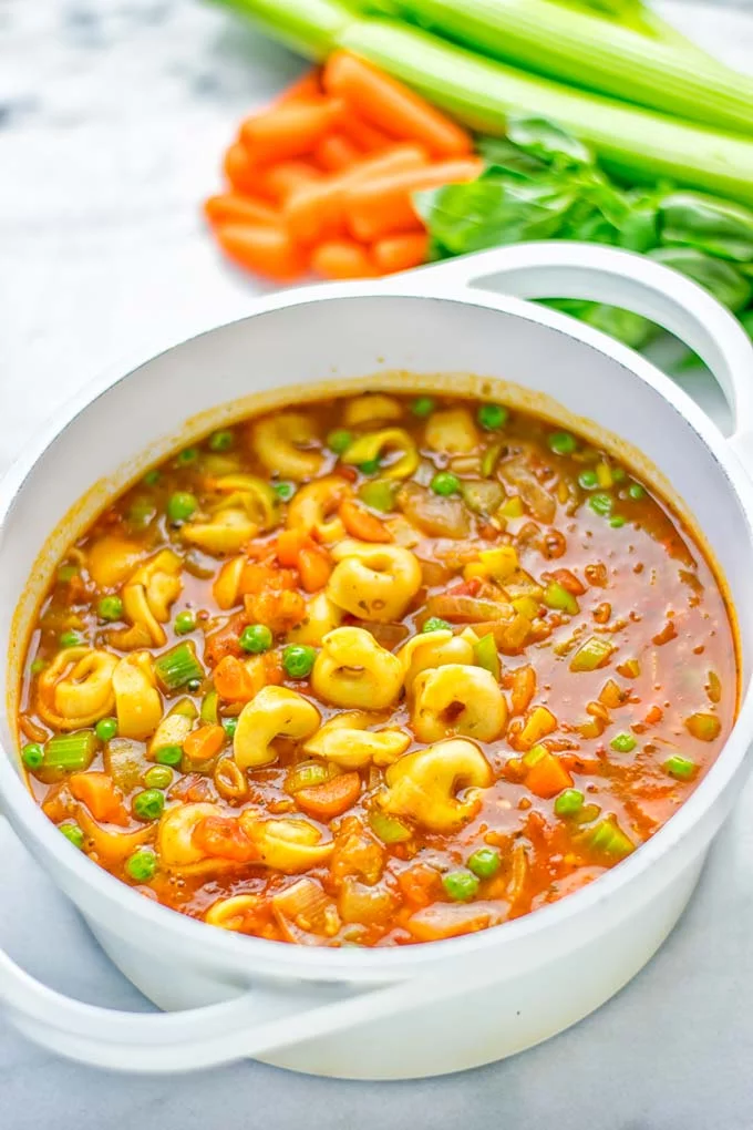 This Minestrone Tortellini Soup is entirely vegan, gluten free and super easy to make in one pot. If you’re looking for a delicious minestrone recipe look no further and try it now for dinner, lunch, meal preparation or an amazing work lunch! #vegan #glutenfree #dairyfree #vegetarian #contentednesscooking #mealprep #onepotmeals #dinner #lunch #worklunchideas #minestrone #tortellinisoup #minestronesoup 