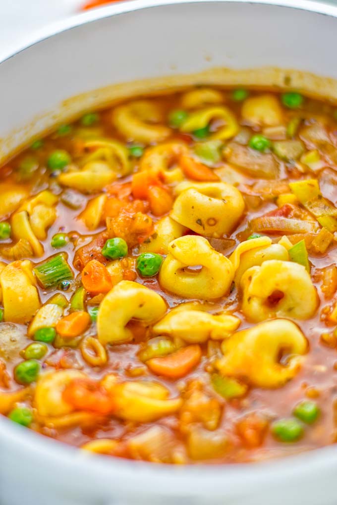 This Minestrone Tortellini Soup is entirely vegan, gluten free and super easy to make in one pot. If you’re looking for a delicious minestrone recipe look no further and try it now for dinner, lunch, meal preparation or an amazing work lunch! #vegan #glutenfree #dairyfree #vegetarian #contentednesscooking #mealprep #onepotmeals #dinner #lunch #worklunchideas #minestrone #tortellinisoup #minestronesoup 