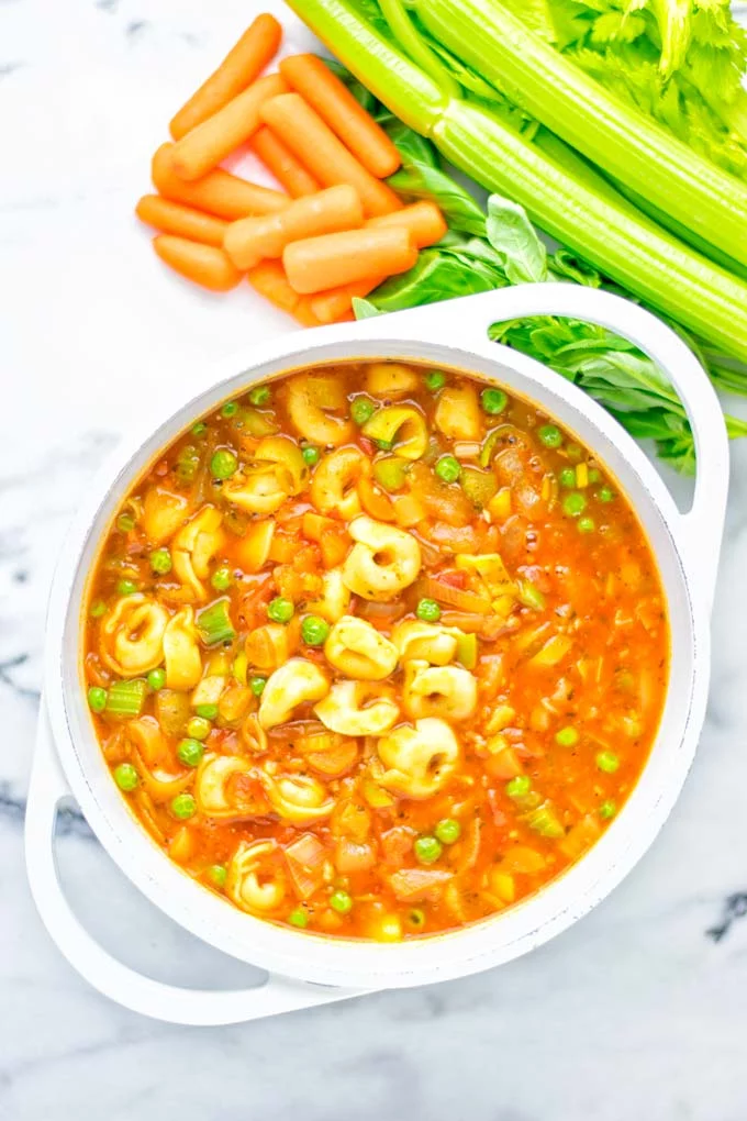 This Minestrone Tortellini Soup is entirely vegan, gluten free and super easy to make in one pot. If you’re looking for a delicious minestrone recipe look no further and try it now for dinner, lunch, meal preparation or an amazing work lunch! #vegan #glutenfree #dairyfree #vegetarian #contentednesscooking #mealprep #onepotmeals #dinner #lunch #worklunchideas #minestrone #tortellinisoup #minestronesoup 