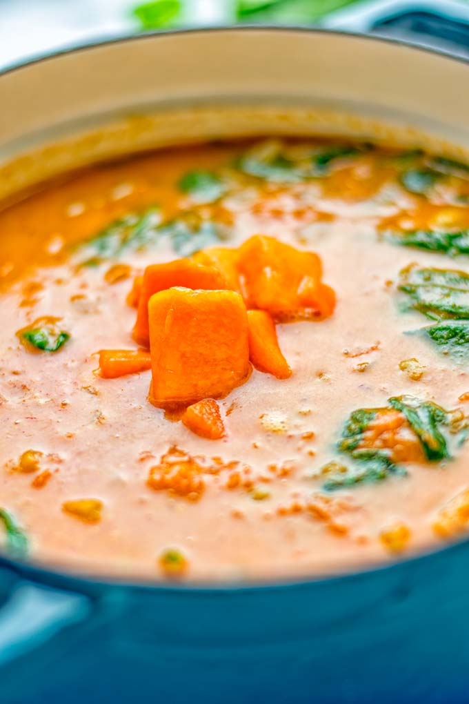 Amazingly satisfying Pumpkin Red Curry. Naturally vegan, gluten free, and so easy to make in one pot. An amazing one pot meal for the holidays, dinner, lunch, meal preparation, and so much more. #vegan #glutenfree #dairyfree #vegetarian #curry #pumpkin #pumpkincurryvegan #dinner #lunch #mealprep #worklunchideas #contentednesscooking #holidays