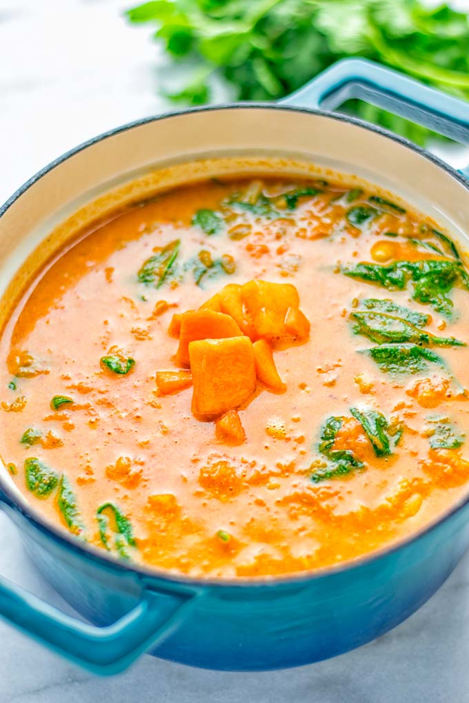 Amazingly satisfying Pumpkin Red Curry. Naturally vegan, gluten free, and so easy to make in one pot. An amazing one pot meal for the holidays, dinner, lunch, meal preparation, and so much more. #vegan #glutenfree #dairyfree #vegetarian #curry #pumpkin #pumpkincurryvegan #dinner #lunch #mealprep #worklunchideas #contentednesscooking #holidays