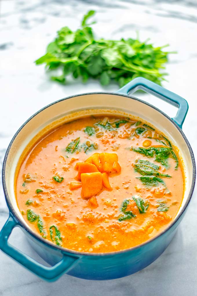 Amazingly satisfying Pumpkin Red Curry. Naturally vegan, gluten free, and so easy to make in one pot. An amazing one pot meal for the holidays, dinner, lunch, meal preparation, and so much more. #vegan #glutenfree #dairyfree #vegetarian #curry #pumpkin #pumpkincurryvegan #dinner #lunch #mealprep #worklunchideas #contentednesscooking #holidays