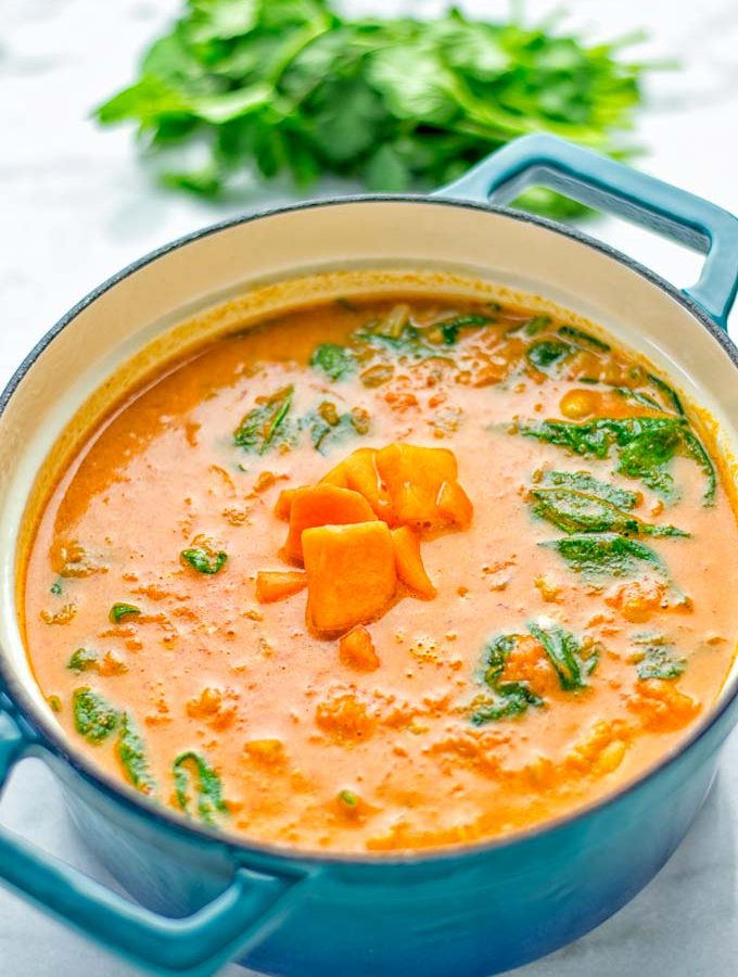 Amazingly satisfying Pumpkin Red Curry. Naturally vegan, gluten free, and so easy to make in one pot. An amazing one pot meal for the holidays, dinner, lunch, meal preparation, and so much more. #vegan #glutenfree #dairyfree #vegetarian #curry #pumpkin #pumpkincurryvegan #dinner #lunch #mealprep #worklunchideas #contentednesscooking #holidays