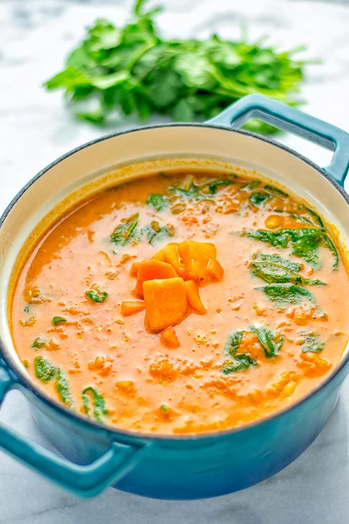 Amazingly satisfying Pumpkin Red Curry. Naturally vegan, gluten free, and so easy to make in one pot. An amazing one pot meal for the holidays, dinner, lunch, meal preparation, and so much more. #vegan #glutenfree #dairyfree #vegetarian #curry #pumpkin #pumpkincurryvegan #dinner #lunch #mealprep #worklunchideas #contentednesscooking #holidays