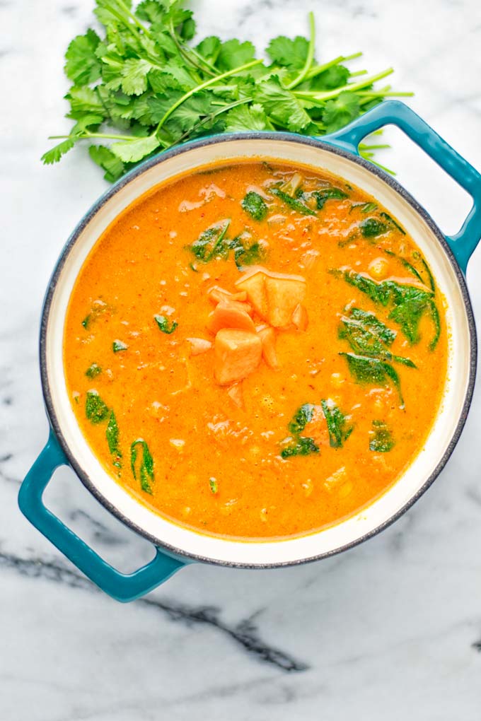 Amazingly satisfying Pumpkin Red Curry. Naturally vegan, gluten free, and so easy to make in one pot. An amazing one pot meal for the holidays, dinner, lunch, meal preparation, and so much more. #vegan #glutenfree #dairyfree #vegetarian #curry #pumpkin #pumpkincurryvegan #dinner #lunch #mealprep #worklunchideas #contentednesscooking #holidays