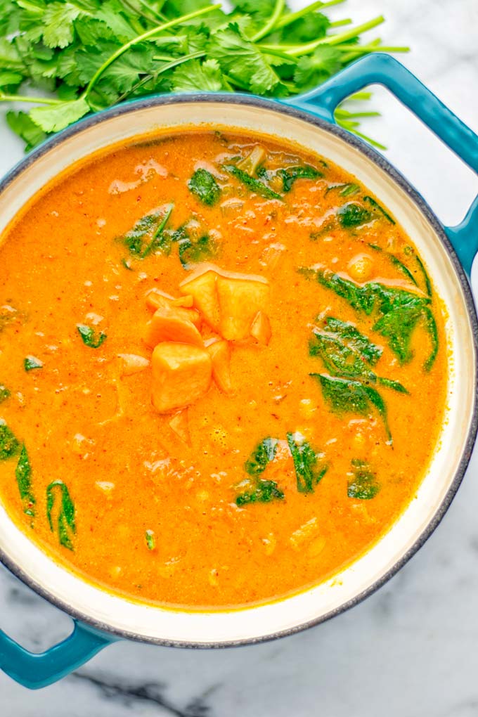 Amazingly satisfying Pumpkin Red Curry. Naturally vegan, gluten free, and so easy to make in one pot. An amazing one pot meal for the holidays, dinner, lunch, meal preparation, and so much more. #vegan #glutenfree #dairyfree #vegetarian #curry #pumpkin #pumpkincurryvegan #dinner #lunch #mealprep #worklunchideas #contentednesscooking #holidays