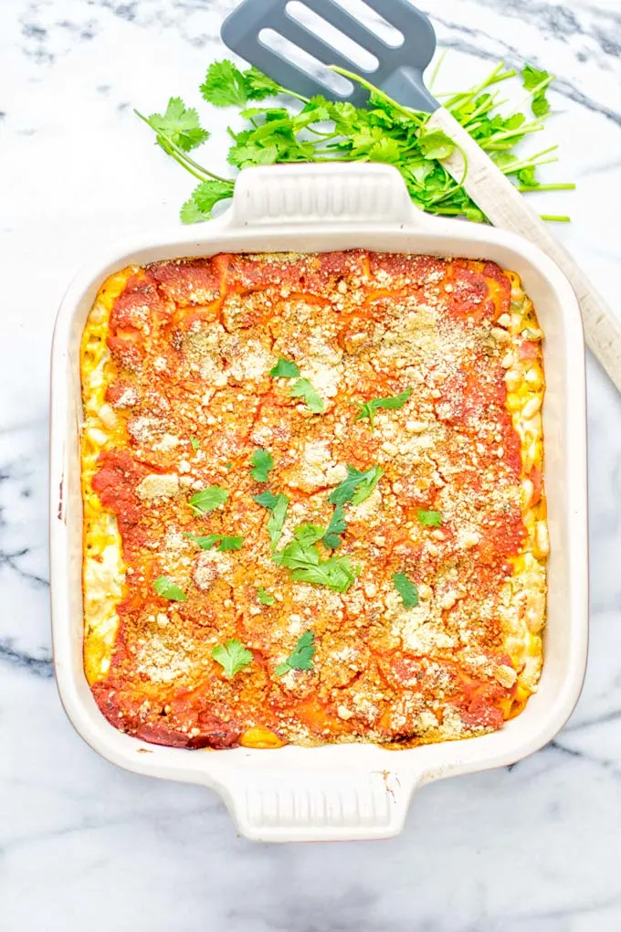 Super easy and insanely delicious White Chili Lasagna. Entirely vegan, gluten free and seriously so addictive. It’s fantastic for dinner, lunch, meal preparation, work lunch that the whole family will love. Also a keeper for the holidays and date night. If you’re looking for an easy lasagna recipe try this, now. #vegan #dairyfree #glutenfree #vegetarian #lasagna #mealprep #worklunchideas #whitechili #whitechilirecipes #holidays #dinner #lunch #datenightrecipesdinner #contentednesscooking