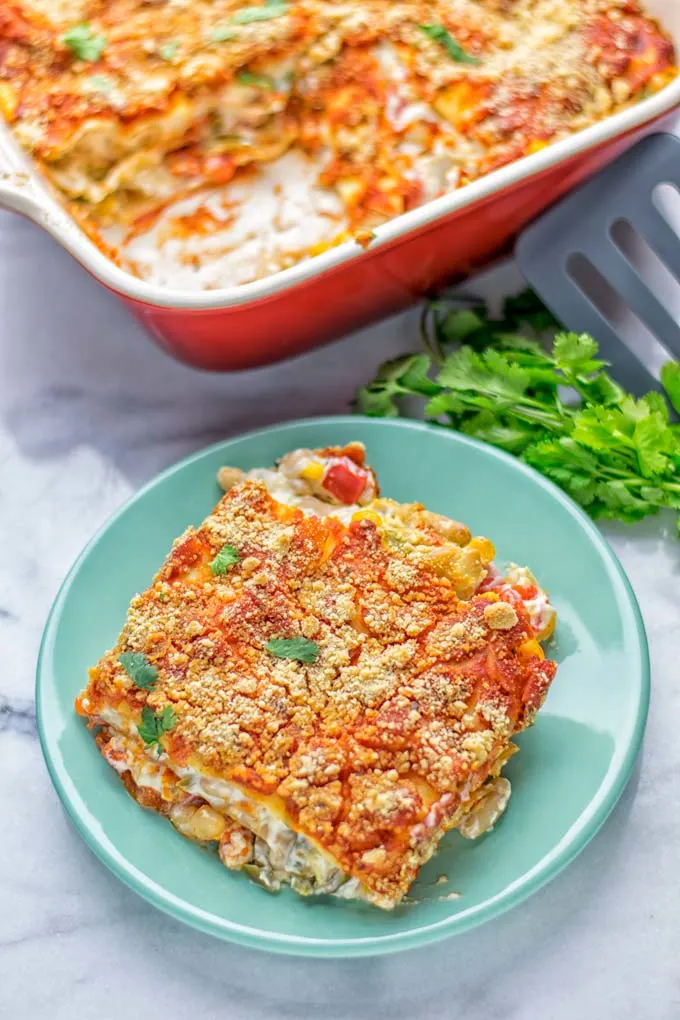 Super easy and insanely delicious White Chili Lasagna. Entirely vegan, gluten free and seriously so addictive. It’s fantastic for dinner, lunch, meal preparation, work lunch that the whole family will love. Also a keeper for the holidays and date night. If you’re looking for an easy lasagna recipe try this, now. #vegan #dairyfree #glutenfree #vegetarian #lasagna #mealprep #worklunchideas #whitechili #whitechilirecipes #holidays #dinner #lunch #datenightrecipesdinner #contentednesscooking