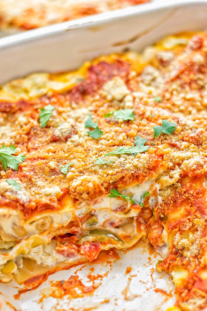 Super easy and insanely delicious White Chili Lasagna. Entirely vegan, gluten free and seriously so addictive. It’s fantastic for dinner, lunch, meal preparation, work lunch that the whole family will love. Also a keeper for the holidays and date night. If you’re looking for an easy lasagna recipe try this, now. #vegan #dairyfree #glutenfree #vegetarian #lasagna #mealprep #worklunchideas #whitechili #whitechilirecipes #holidays #dinner #lunch #datenightrecipesdinner #contentednesscooking