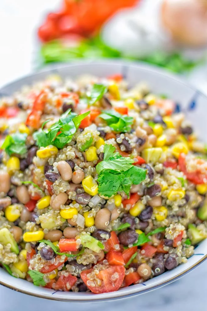 This Cowboy Caviar Quinoa Salad is naturally vegan, gluten free, and so satisfying. It has all the flavors you’ll love and is super easy to make for dinner, lunch, meal prep and so much more. Enjoy and try it now You’ll know how easy it can be. #vegan #glutenfree #dairyfree #vegetarian #cowboycaviar #quinoasalad #dinner #lunch #mealprep #worklunchideas #contentednesscooking #healthymeals #newyearhealthyeating #potluckideas #partyfood