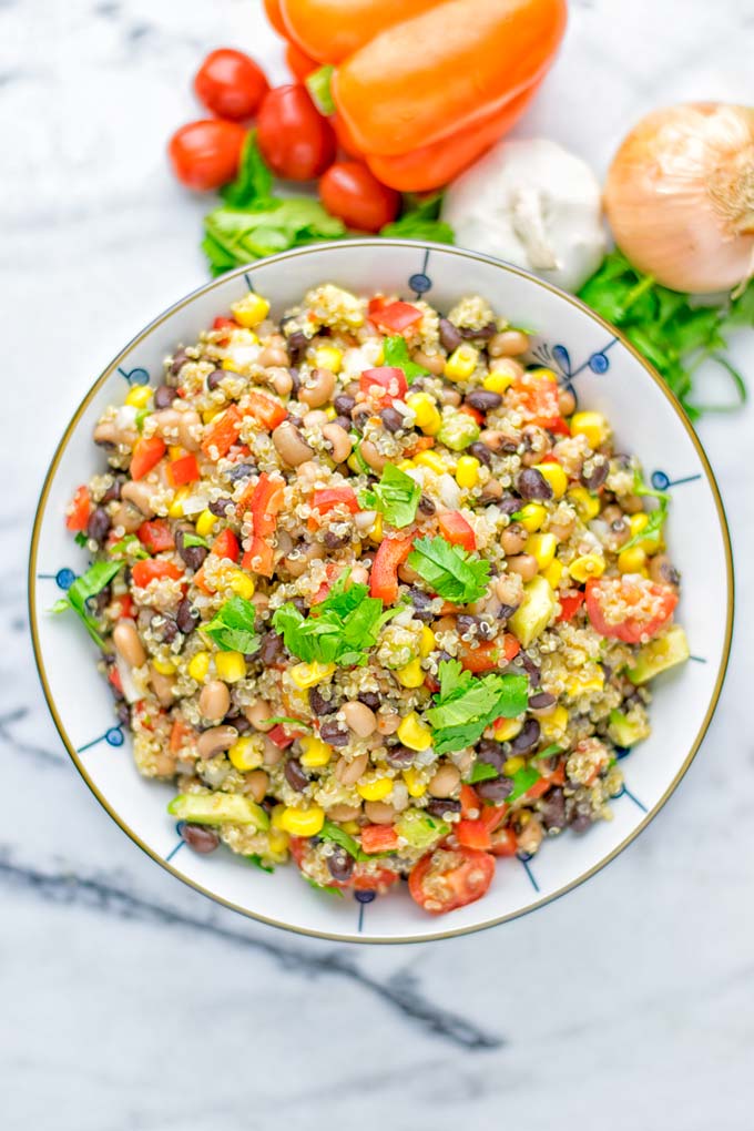 This Cowboy Caviar Quinoa Salad is naturally vegan, gluten free, and so satisfying. It has all the flavors you’ll love and is super easy to make for dinner, lunch, meal prep and so much more. Enjoy and try it now You’ll know how easy it can be. #vegan #glutenfree #dairyfree #vegetarian #cowboycaviar #quinoasalad #dinner #lunch #mealprep #worklunchideas #contentednesscooking #healthymeals #newyearhealthyeating #potluckideas #partyfood