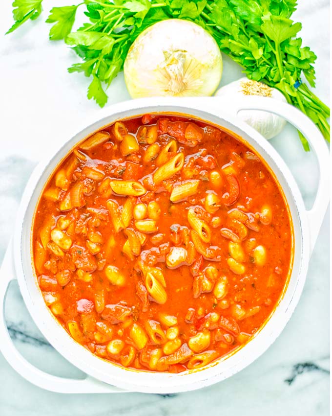 This Pasta Fagioli Soup is super easy to make in one pot and entirely vegan, gluten free. It’s packed with so many delicious flavors and perfect for dinner, lunch, meal prep, work lunch and so much more. Try it and learn how easy it can be to make food for the whole family. #vegan #glutenfree #dairyfree #onepotmeals #vegetarian #contentednesscooking #mealprep #worklunchideas #dinner #lunch #pastafagiolisoup #20minutemeals