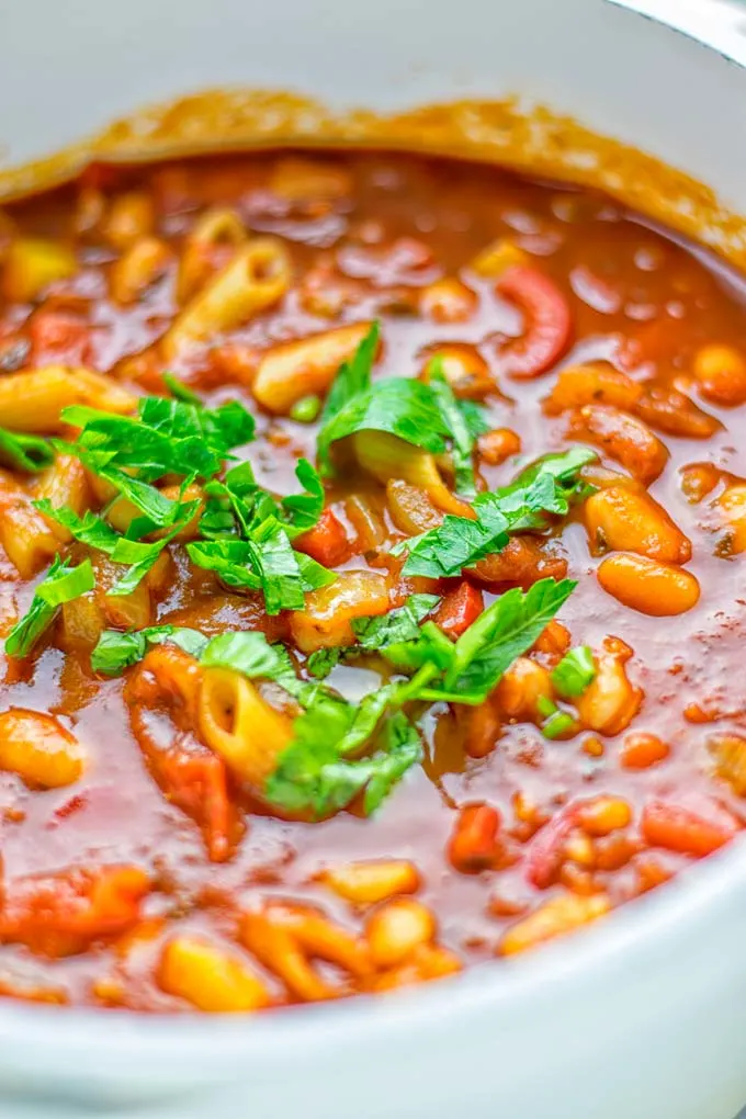 This Pasta Fagioli Soup is super easy to make in one pot and entirely vegan, gluten free. It’s packed with so many delicious flavors and perfect for dinner, lunch, meal prep, work lunch and so much more. Try it and learn how easy it can be to make food for the whole family. #vegan #glutenfree #dairyfree #onepotmeals #vegetarian #contentednesscooking #mealprep #worklunchideas #dinner #lunch #pastafagiolisoup #20minutemeals