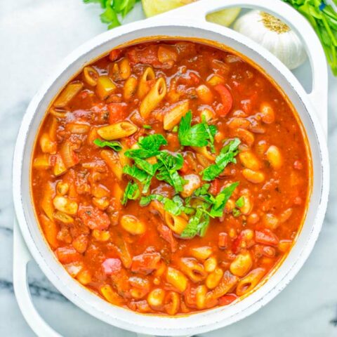 This Pasta Fagioli Soup is super easy to make in one pot and entirely vegan, gluten free. It’s packed with so many delicious flavors and perfect for dinner, lunch, meal prep, work lunch and so much more. Try it and learn how easy it can be to make food for the whole family. #vegan #glutenfree #dairyfree #onepotmeals #vegetarian #contentednesscooking #mealprep #worklunchideas #dinner #lunch #pastafagiolisoup #20minutemeals