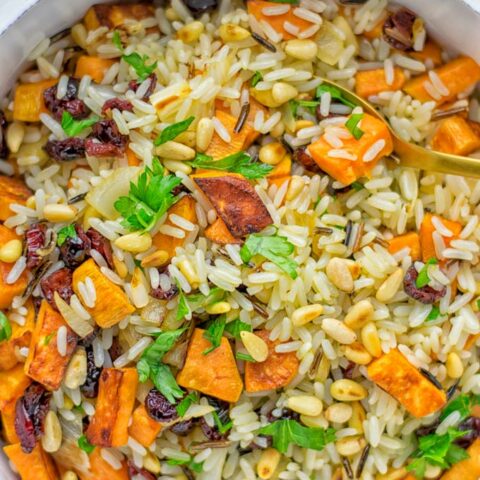 This Wild Rice Pilaf is a super easy and tasty one pot meal. Naturally vegan, gluten free it has all the flavors you love and want for Christmas and the whole year. Try it now for dinner, lunch, meal prep, wow your guests and family. #vegan #glutenfree #dairyfree #vegetarian #christmasfood #dinner #lunch #onepotmeals #holidayfood #wildricepilaf #ricepilafeasy #worklunchideas #contentednesscooking #mealprep