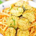 This Baked Zucchini Parmesan is entirely vegan, gluten free and will be a family favorite. Serve it with pasta, dips, as appetizer, dinner, lunches, meal preparation, or work lunch. Sprinkled with the best dairy free parmesan cheese that makes all the difference. Try it now. #vegan #dairyfree #vegetarian #contentednesscooking #dinner #lunch #mealprep #worklunchideas #zucchiniparmesan #zucchiniparmesanbaked #zucchiniparmesancrisps #comfortfood #kidfriendlydinners #familydinnerideas