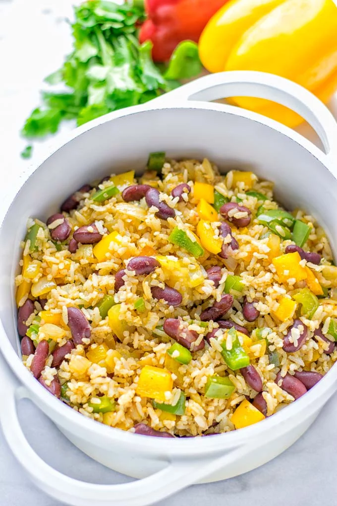 This Cajun Red Beans and Rice is an amazing one pot meal which is naturally vegan, gluten free. It’s packed with bold and fantastic flavors the whole family will love for dinner, lunch, meal prep and work lunch and so much more. Once you’ve tried this you can’t stop eating it so easy to make! #vegan #dairyfree #glutenfree #vegetarian #onepotmeals #dinner #lunch #worklunchideas #budgetmeals #contentednesscooking #cajunbeansandrice #mealprep 