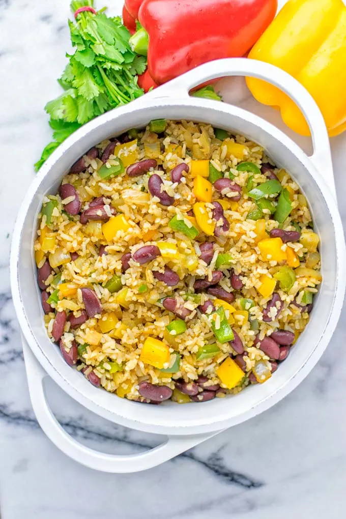 This Cajun Red Beans and Rice is an amazing one pot meal which is naturally vegan, gluten free. It’s packed with bold and fantastic flavors the whole family will love for dinner, lunch, meal prep and work lunch and so much more. Once you’ve tried this you can’t stop eating it so easy to make! #vegan #dairyfree #glutenfree #vegetarian #onepotmeals #dinner #lunch #worklunchideas #budgetmeals #contentednesscooking #cajunbeansandrice #mealprep 