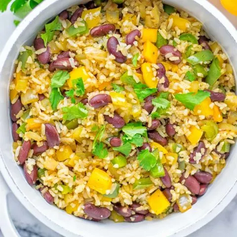 This Cajun Red Beans and Rice is an amazing one pot meal which is naturally vegan, gluten free. It’s packed with bold and fantastic flavors the whole family will love for dinner, lunch, meal prep and work lunch and so much more. Once you’ve tried this you can’t stop eating it so easy to make! #vegan #dairyfree #glutenfree #vegetarian #onepotmeals #dinner #lunch #worklunchideas #budgetmeals #contentednesscooking #cajunbeansandrice #mealprep