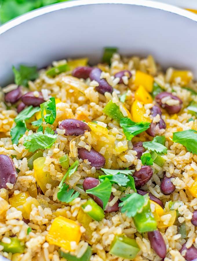 This Cajun Red Beans and Rice is an amazing one pot meal which is naturally vegan, gluten free. It’s packed with bold and fantastic flavors the whole family will love for dinner, lunch, meal prep and work lunch and so much more. Once you’ve tried this you can’t stop eating it so easy to make! #vegan #dairyfree #glutenfree #vegetarian #onepotmeals #dinner #lunch #worklunchideas #budgetmeals #contentednesscooking #cajunbeansandrice #mealprep