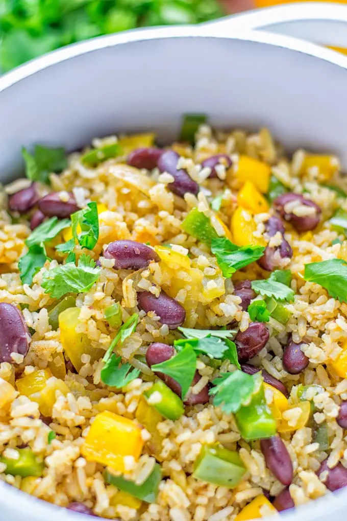 This Cajun Red Beans and Rice is an amazing one pot meal which is naturally vegan, gluten free. It’s packed with bold and fantastic flavors the whole family will love for dinner, lunch, meal prep and work lunch and so much more. Once you’ve tried this you can’t stop eating it so easy to make! #vegan #dairyfree #glutenfree #vegetarian #onepotmeals #dinner #lunch #worklunchideas #budgetmeals #contentednesscooking #cajunbeansandrice #mealprep 