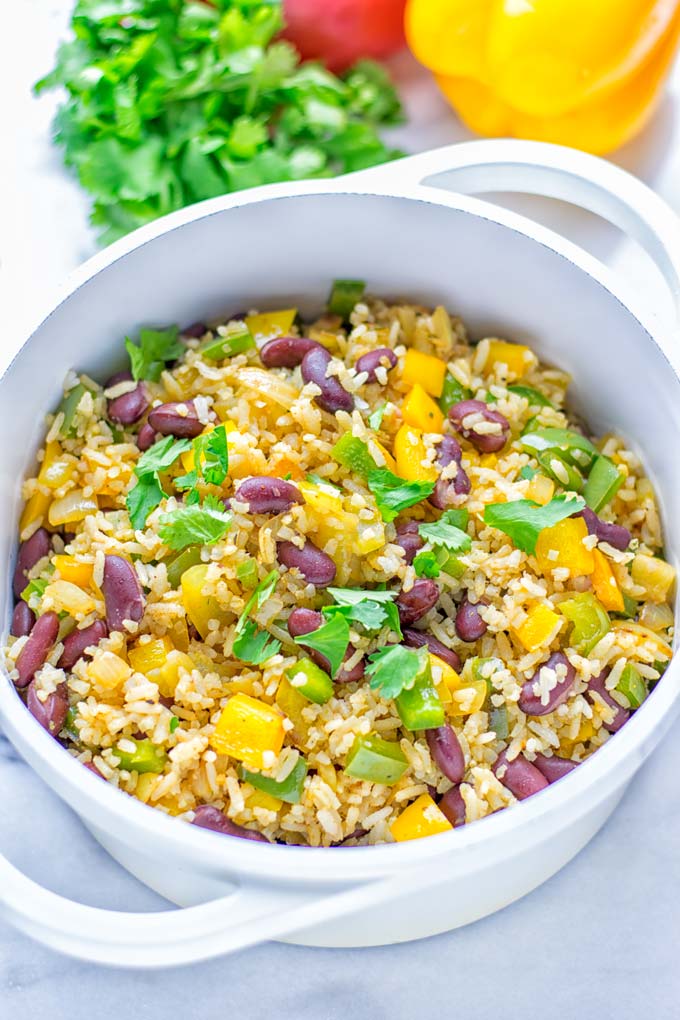 This Cajun Red Beans and Rice is an amazing one pot meal which is naturally vegan, gluten free. It’s packed with bold and fantastic flavors the whole family will love for dinner, lunch, meal prep and work lunch and so much more. Once you’ve tried this you can’t stop eating it so easy to make! #vegan #dairyfree #glutenfree #vegetarian #onepotmeals #dinner #lunch #worklunchideas #budgetmeals #contentednesscooking #cajunbeansandrice #mealprep 