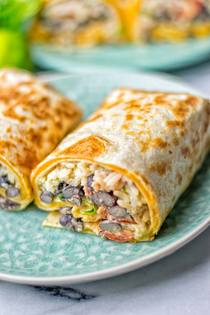 This Rice and Beans Quesarito is entirelly vegan, gluten free and so easy to make. It’s cheesy, incredibly satisfying and so delicious for dinner, lunch, meal prep (reheat beautifully) and amazing for work lunches. An amazing dairy free alternative for everyone that the whole family will love. #vegan #glutenfree #dairyfree #vegetarian #contentednesscooking #quesarito #riceandbeans #dinner #lunch #worklunchideas #mealprep #quesadila #burrito 