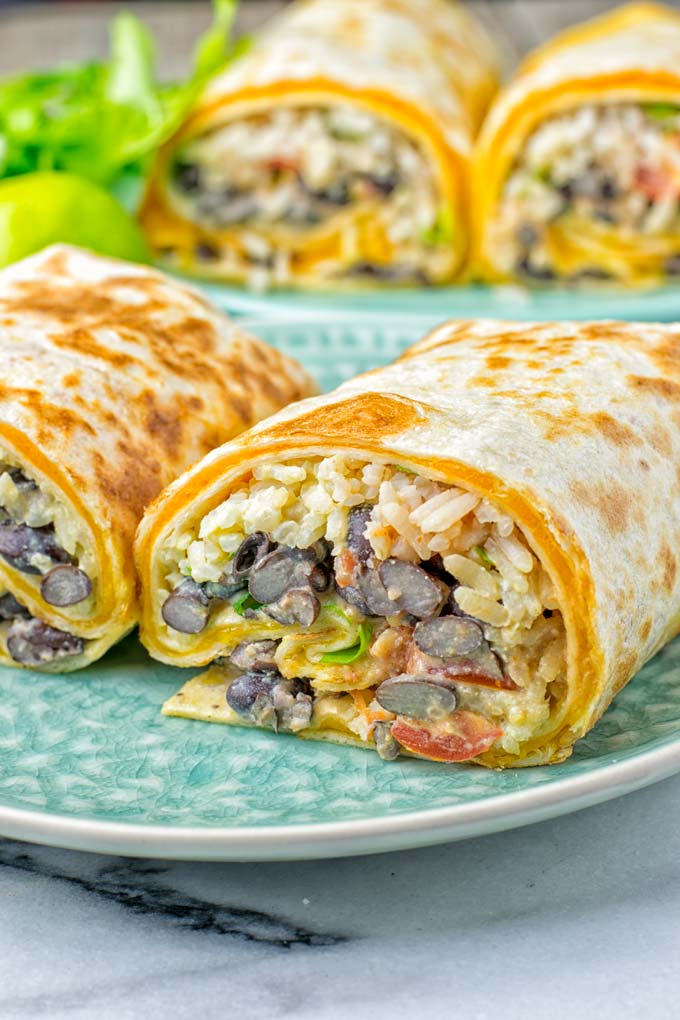 This Rice and Beans Quesarito is entirelly vegan, gluten free and so easy to make. It’s cheesy, incredibly satisfying and so delicious for dinner, lunch, meal prep (reheat beautifully) and amazing for work lunches. An amazing dairy free alternative for everyone that the whole family will love. #vegan #glutenfree #dairyfree #vegetarian #contentednesscooking #quesarito #riceandbeans #dinner #lunch #worklunchideas #mealprep #quesadila #burrito 